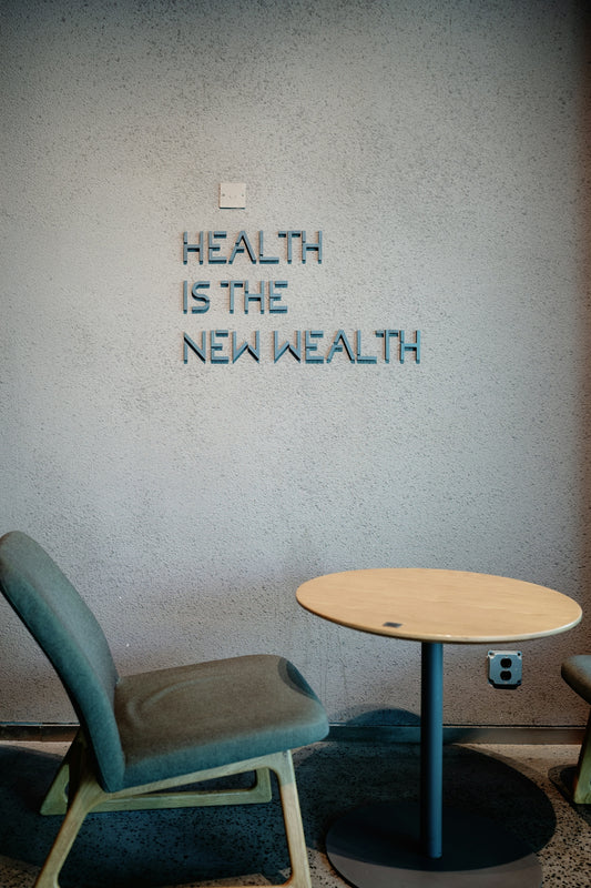Health is the new wealth, shown near a chair.